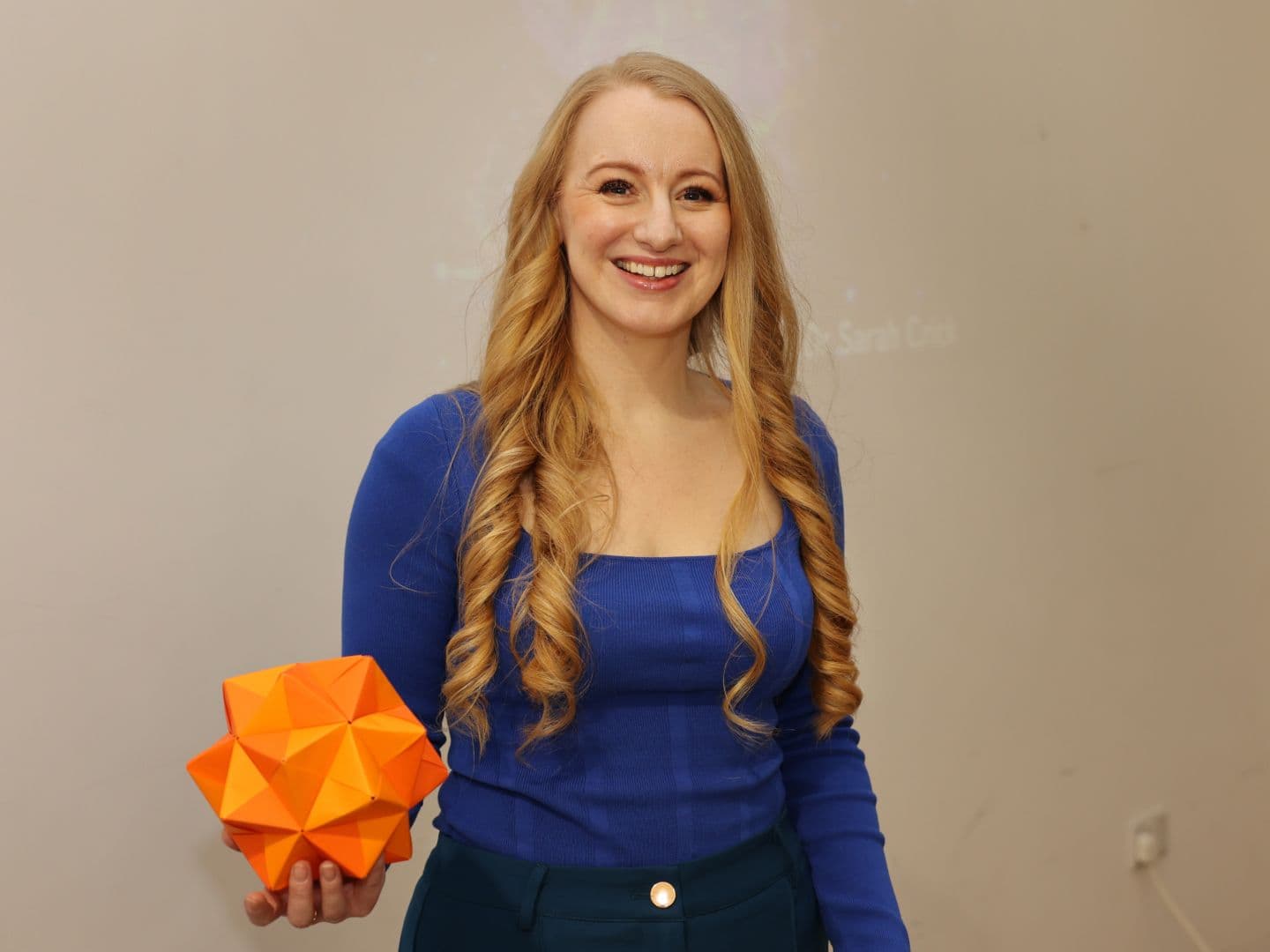 dr sarach crick holding a origami star (1440x1080)