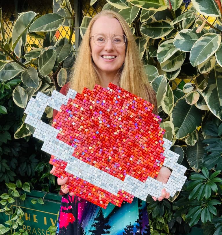 dr sarah crick with a large astronomy mosaic (768x811)